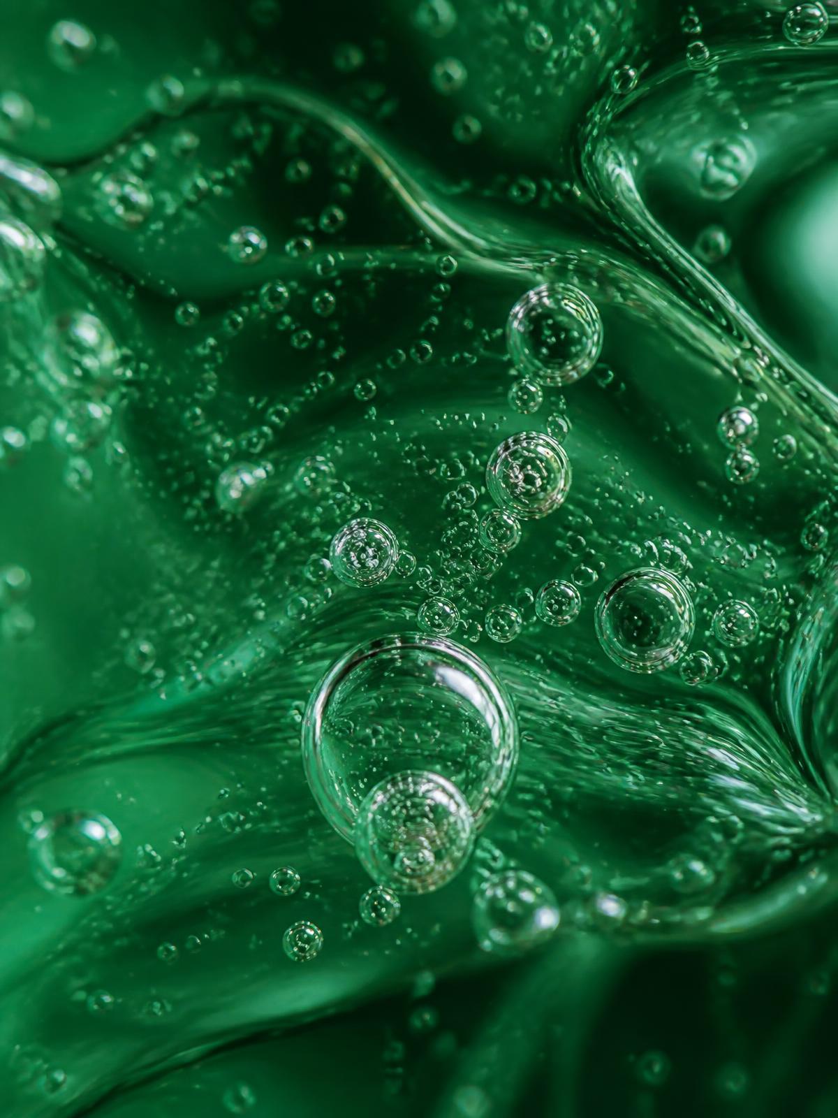 Macro view of active bubbles suspended in a clear cosmetic gel